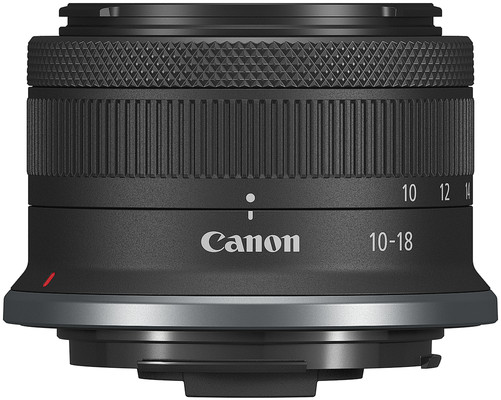 A Canon 10-18mm camera lens with focus and aperture markings, with a black body and silver ring.