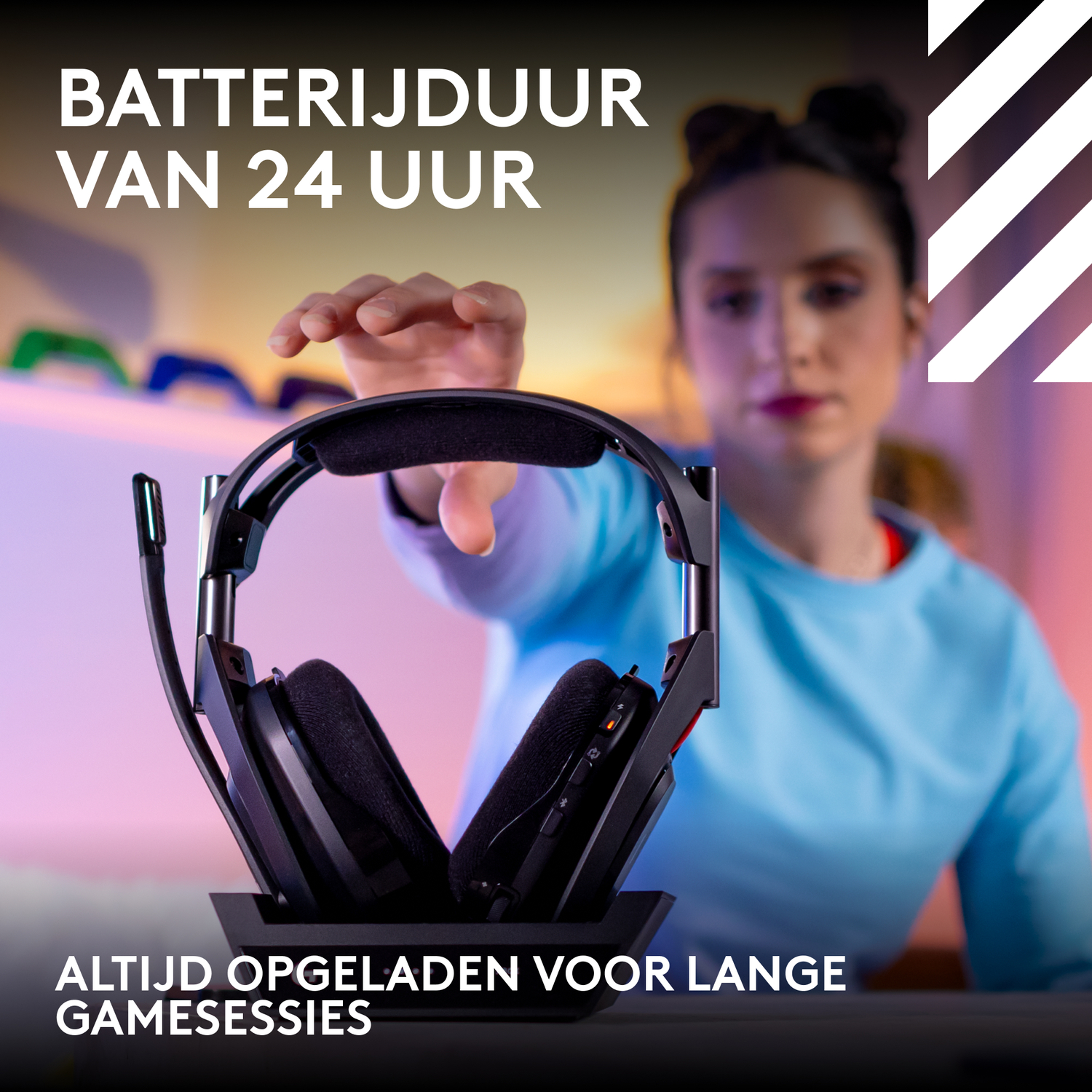 Woman reaching for a gaming headset on a black base with text.