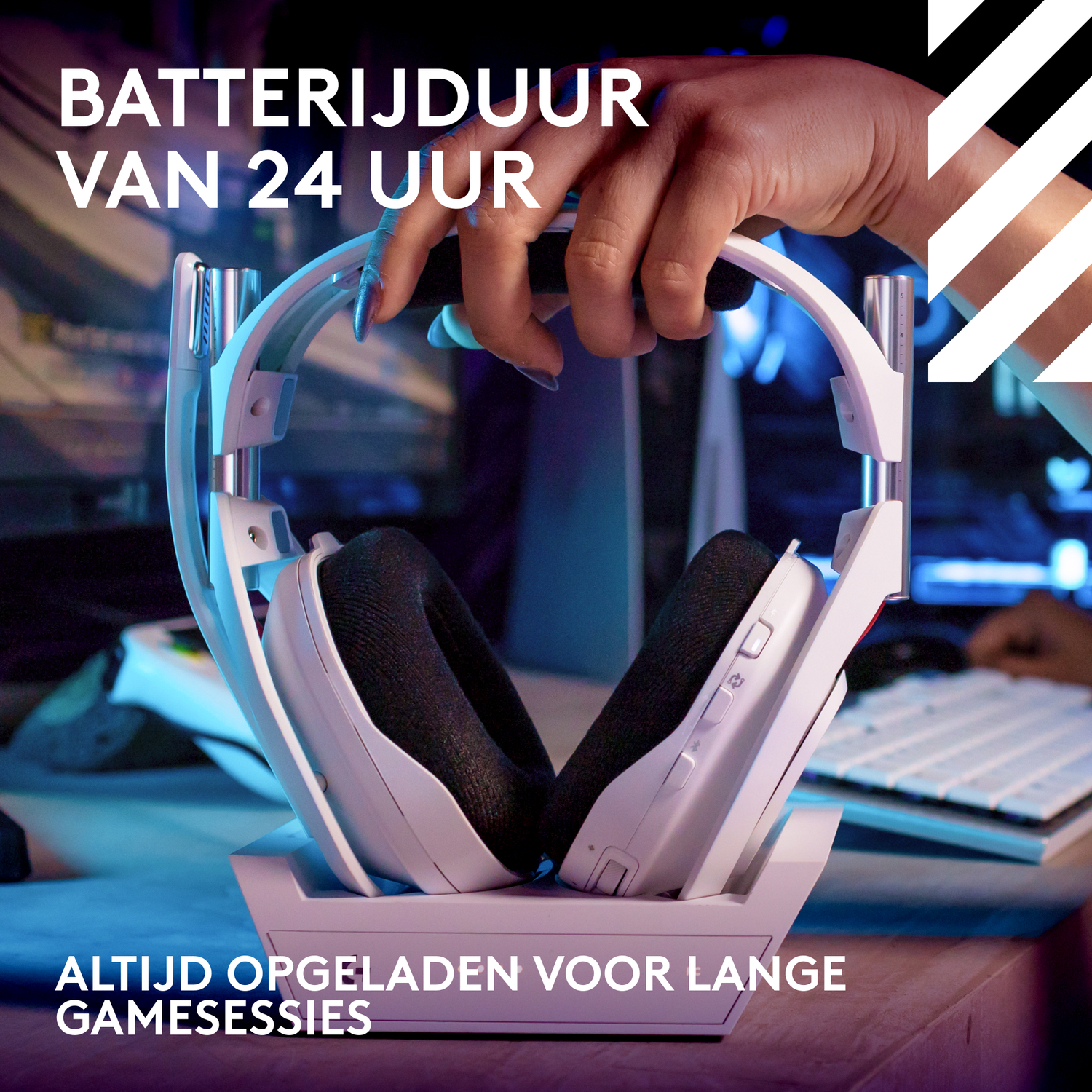 A white gaming headset on its charging stand. The image has text "24 hour battery life".
