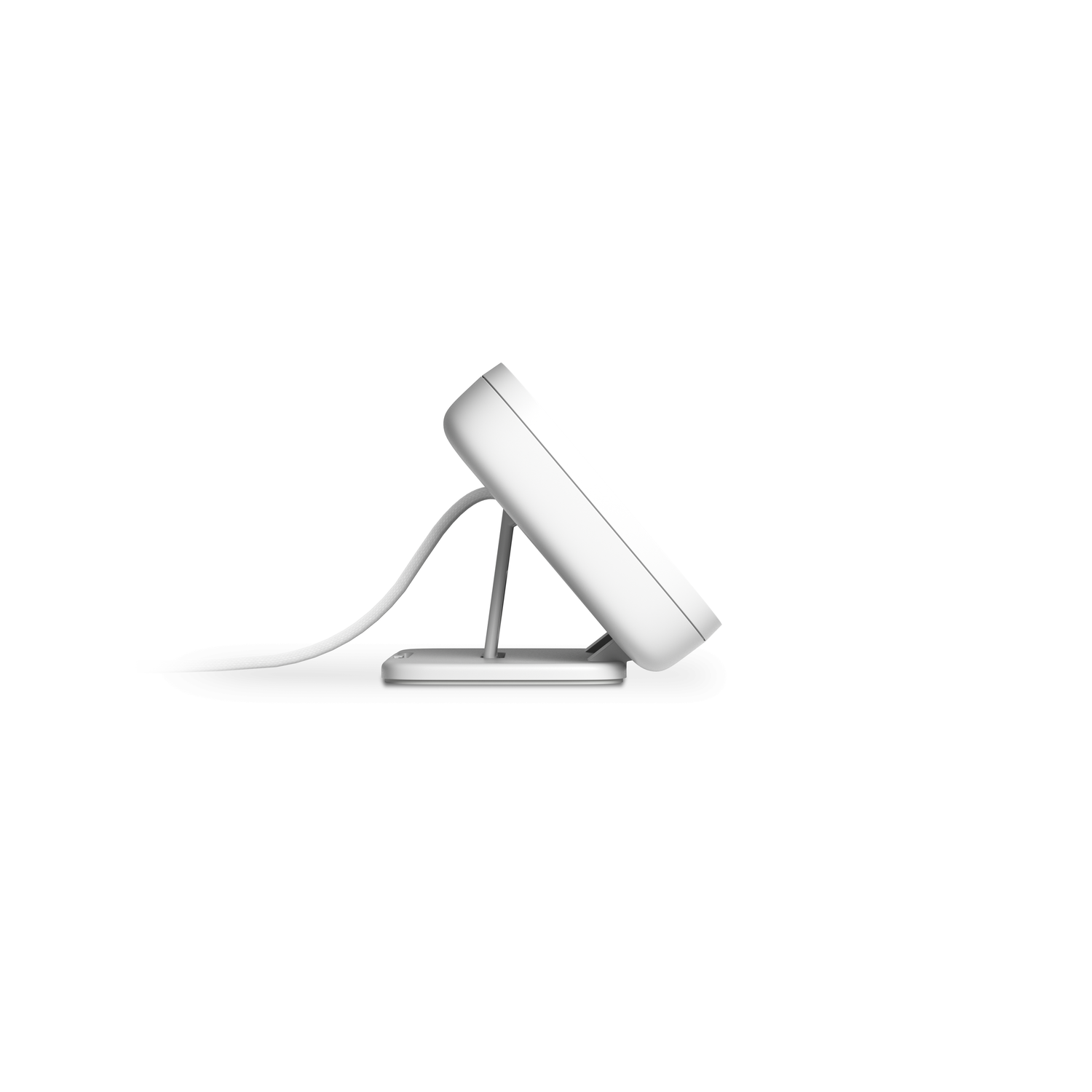 A white device with a stand, angled on white background.