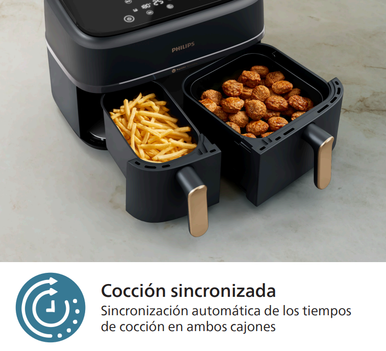 Freidora de aire con dos compartimentos, uno con patatas fritas, otro con albóndigas.