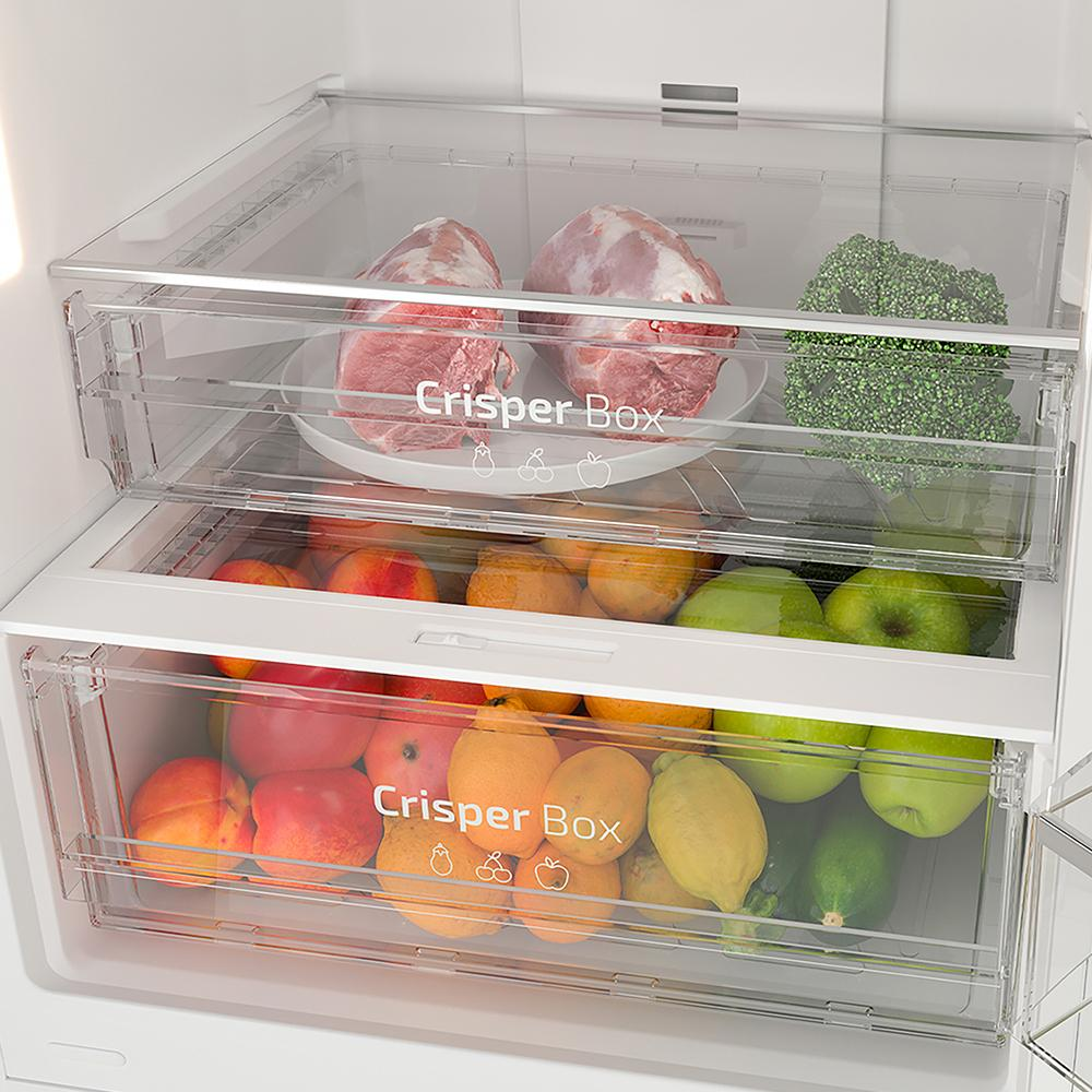 Un refrigerador con dos cajones para verduras. Uno contiene carne, el otro frutas y verduras.