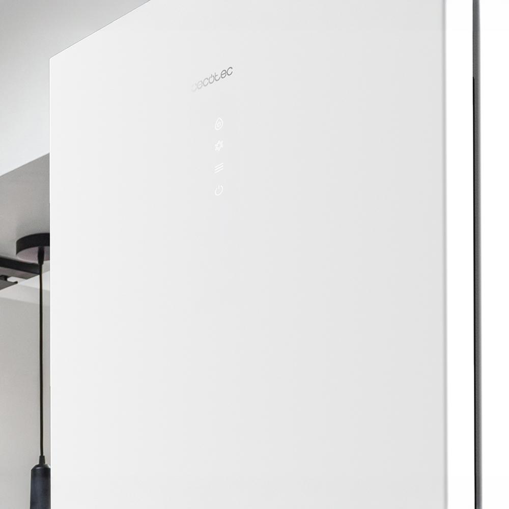 Electrodoméstico blanco con controles iluminados. La marca es visible arriba. Un objeto oscuro cuelga a la izquierda.