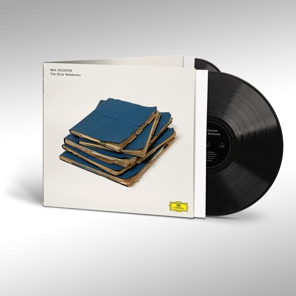 Egy bakelit lemezalbum kék jegyzetfüzeteket ábrázoló borítóval. A borító nyitva van.