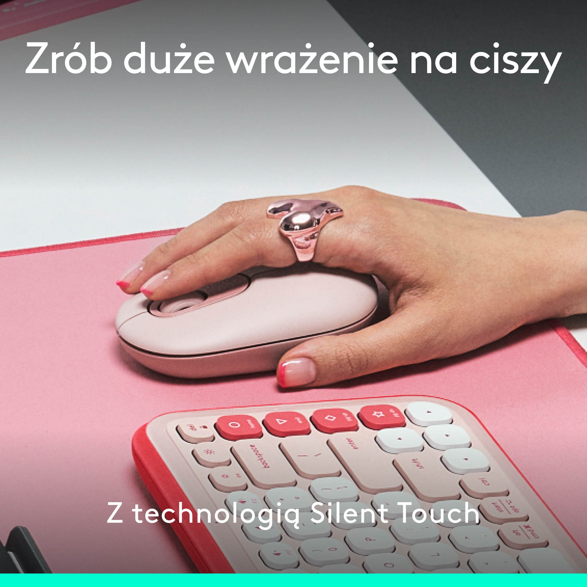 Dłoń z różowym pierścionkiem na różowej myszy, z różową klawiaturą w tle.