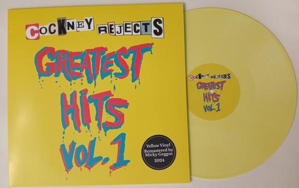 Cockney Rejects Albumcover. Gelber Hintergrund mit Bandnamen und Greatest Hits. Vinylplatte.