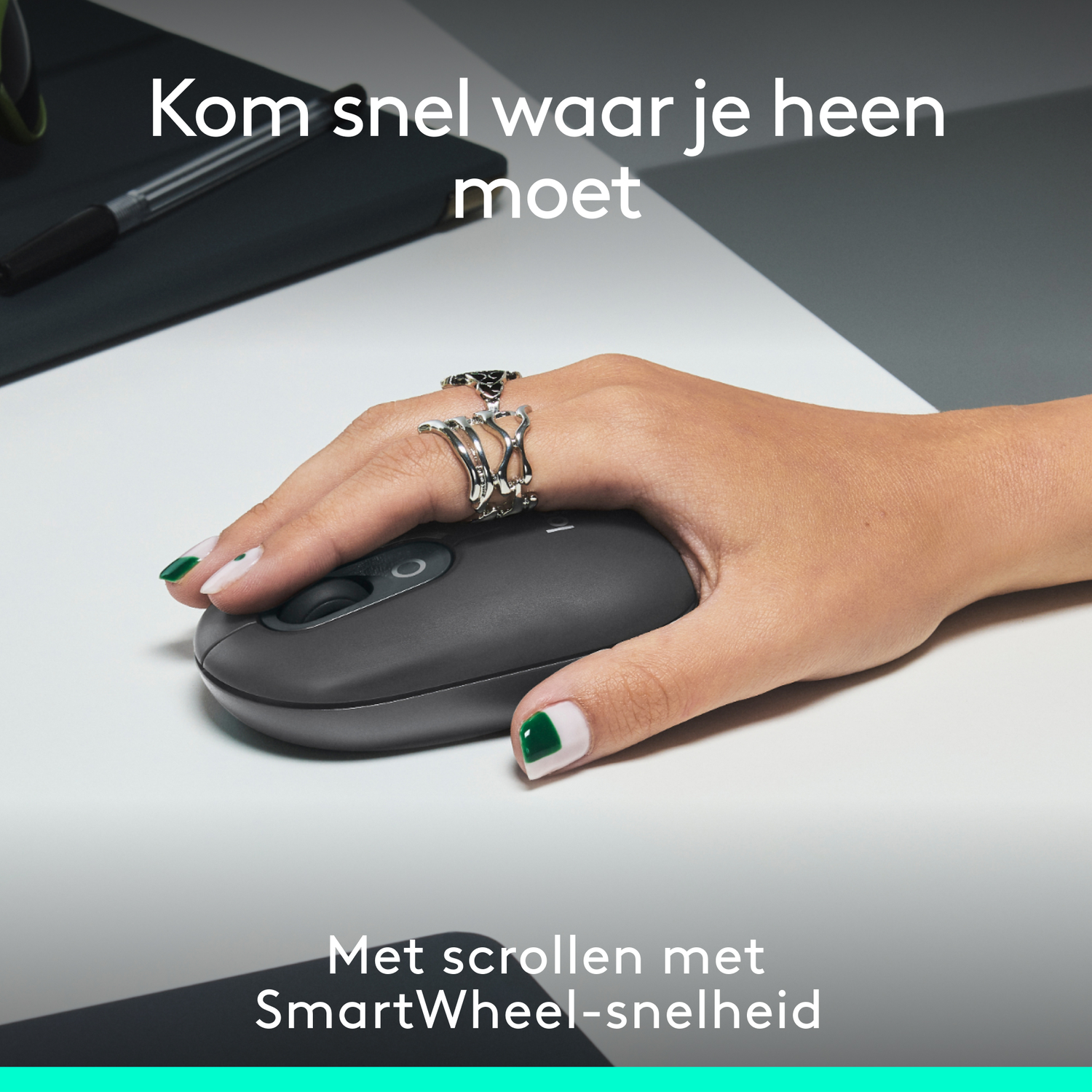 Hand using a grey mouse. Scroll wheel is in the center of the mouse.