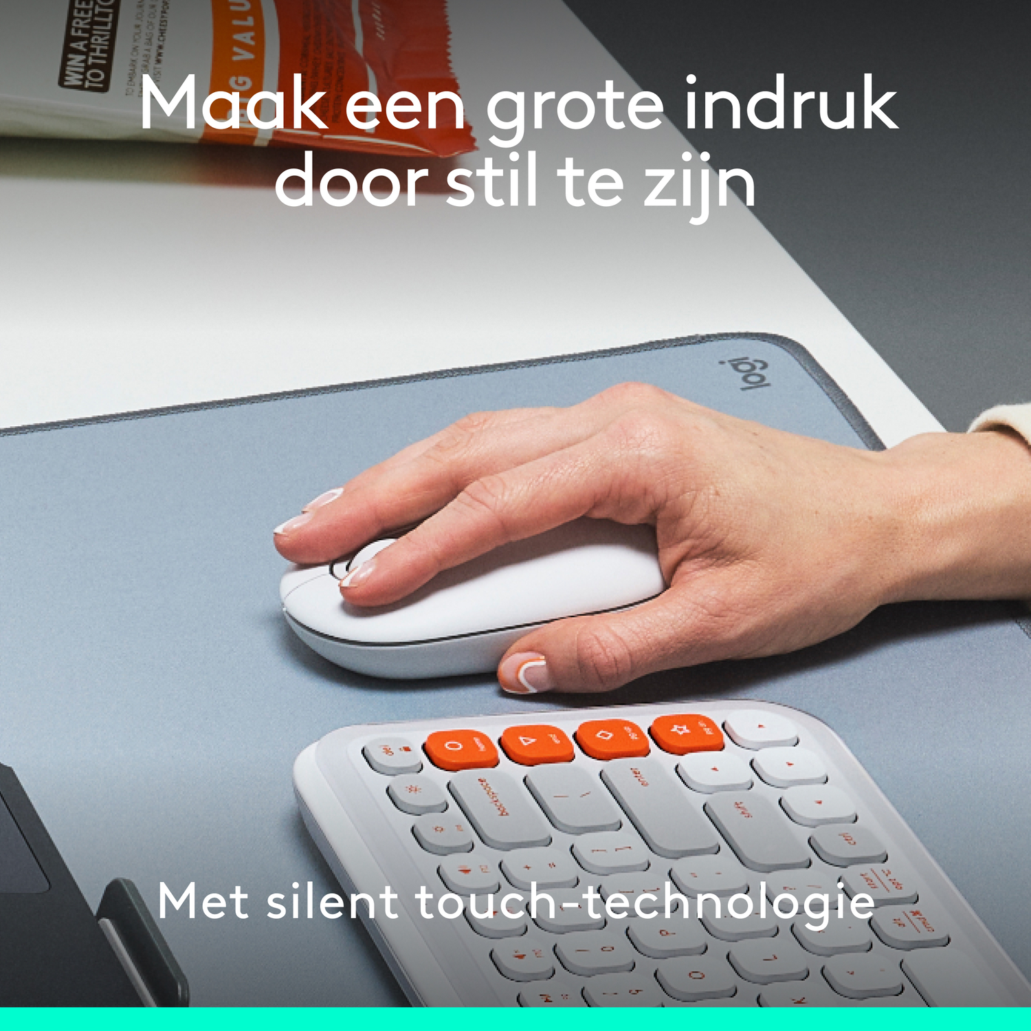 A person's hand on a mouse and keyboard on a gray surface, with text overlay.