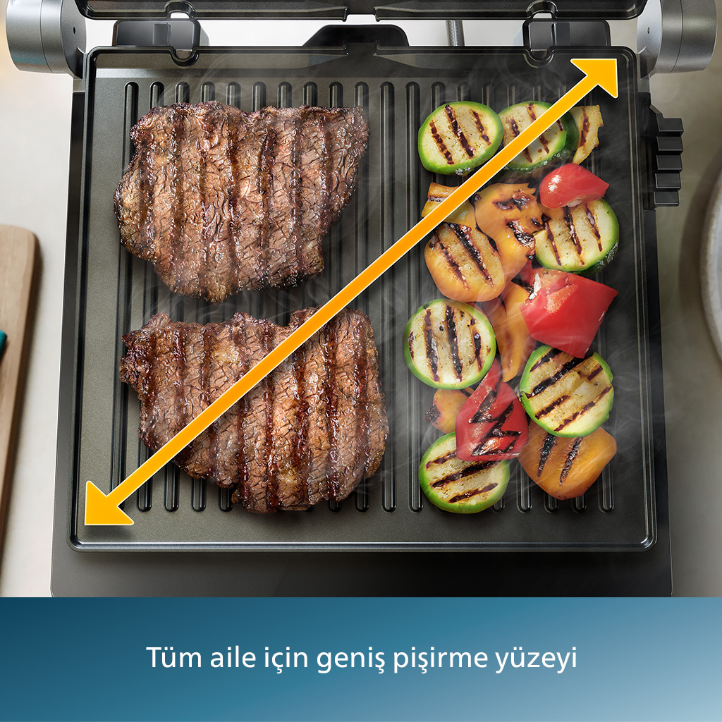 Pişmiş biftek ve sebzelerle ızgara, ok ızgara alanını gösteriyor.