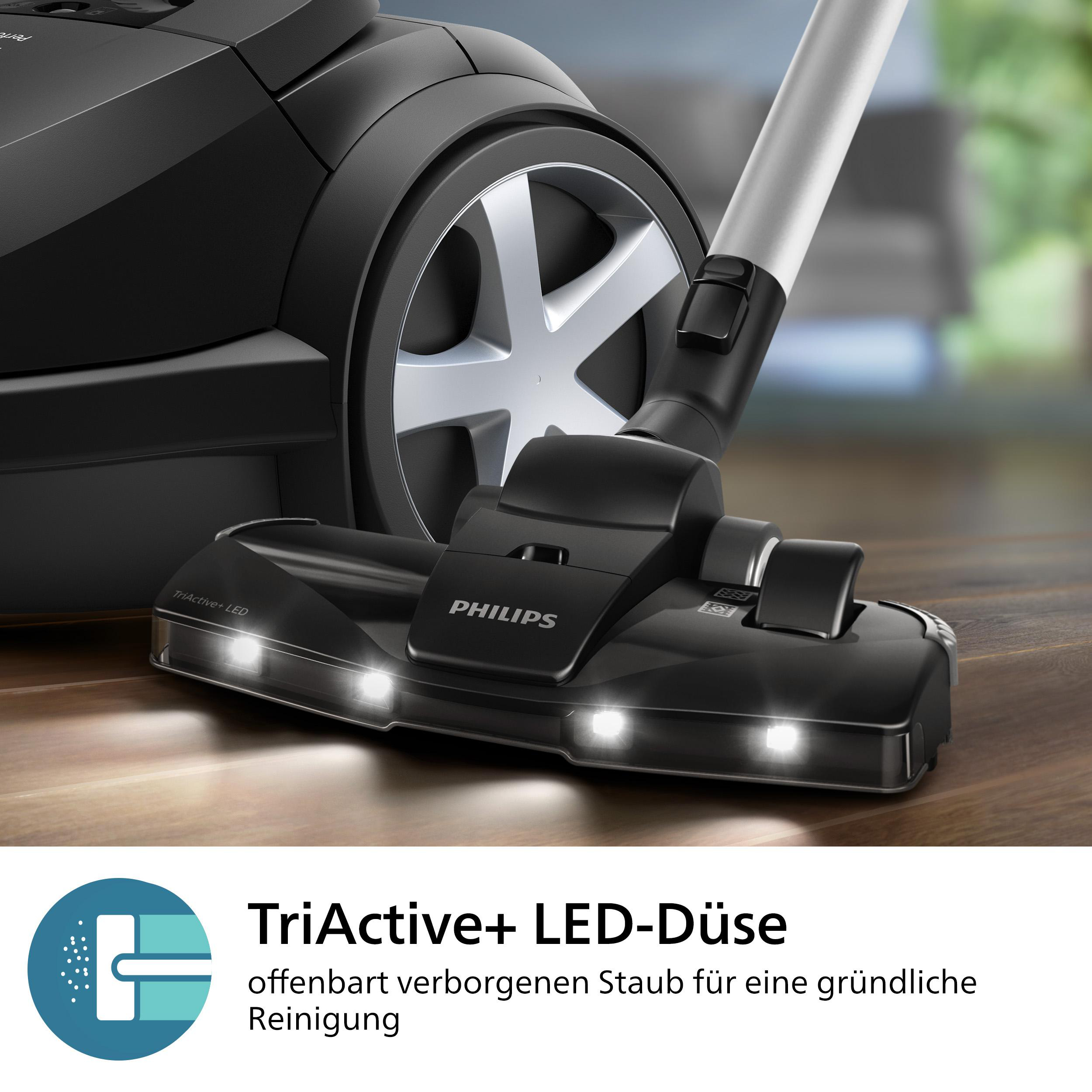 Schwarzer Philips Staubsauger, Nahaufnahme des Kopfes mit LED-Leuchten, darunter der Produktname.