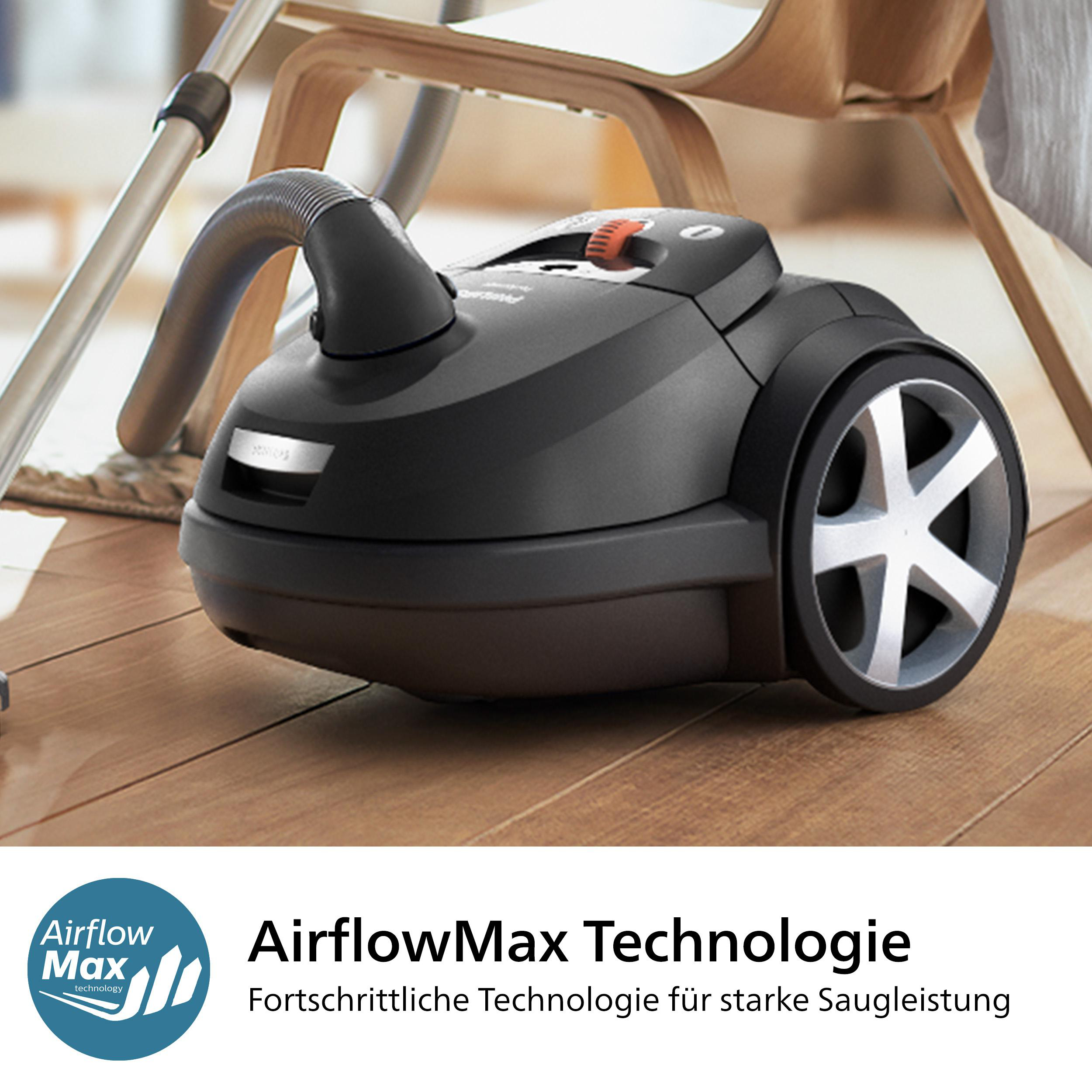 Schwarzer Staubsauger auf Holzboden mit AirflowMax-Technologie.