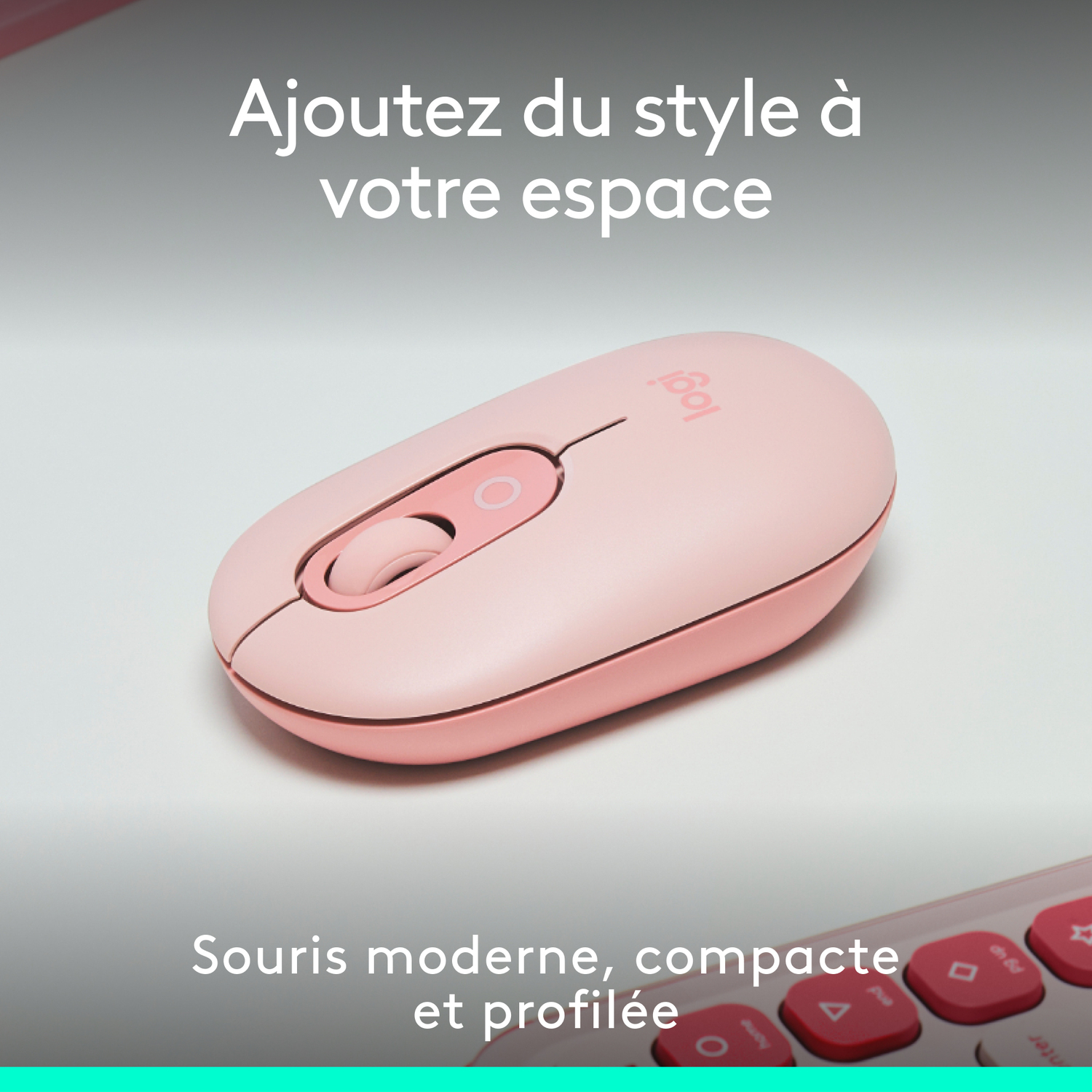 Souris d'ordinateur rose sur surface blanche.