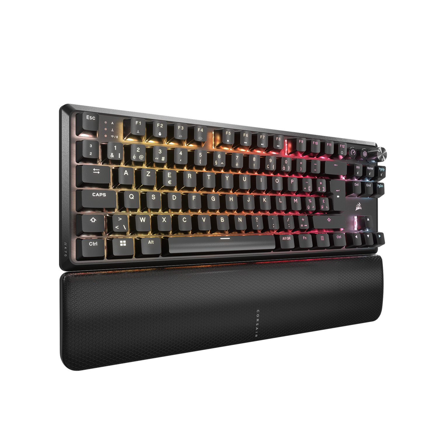 Black keyboard with colorful illuminated keys and wrist rest on a white background.