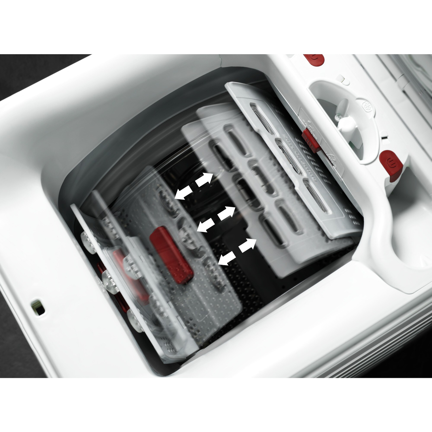 Interior of a washing machine with rotating parts and arrows.