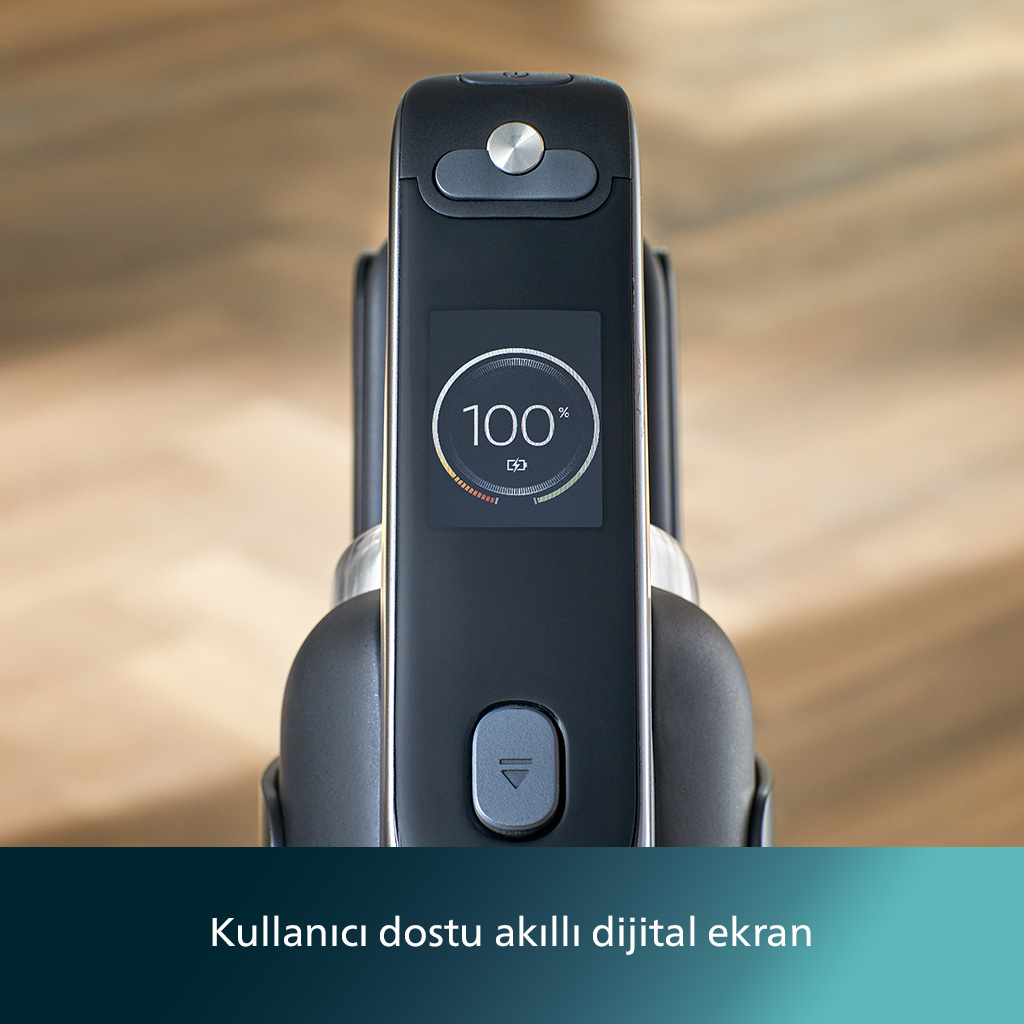 Siyah bir elektrikli süpürge ekranının, %100 pil gösteren yakın çekimi. Ekranın altında gri bir düğme var.