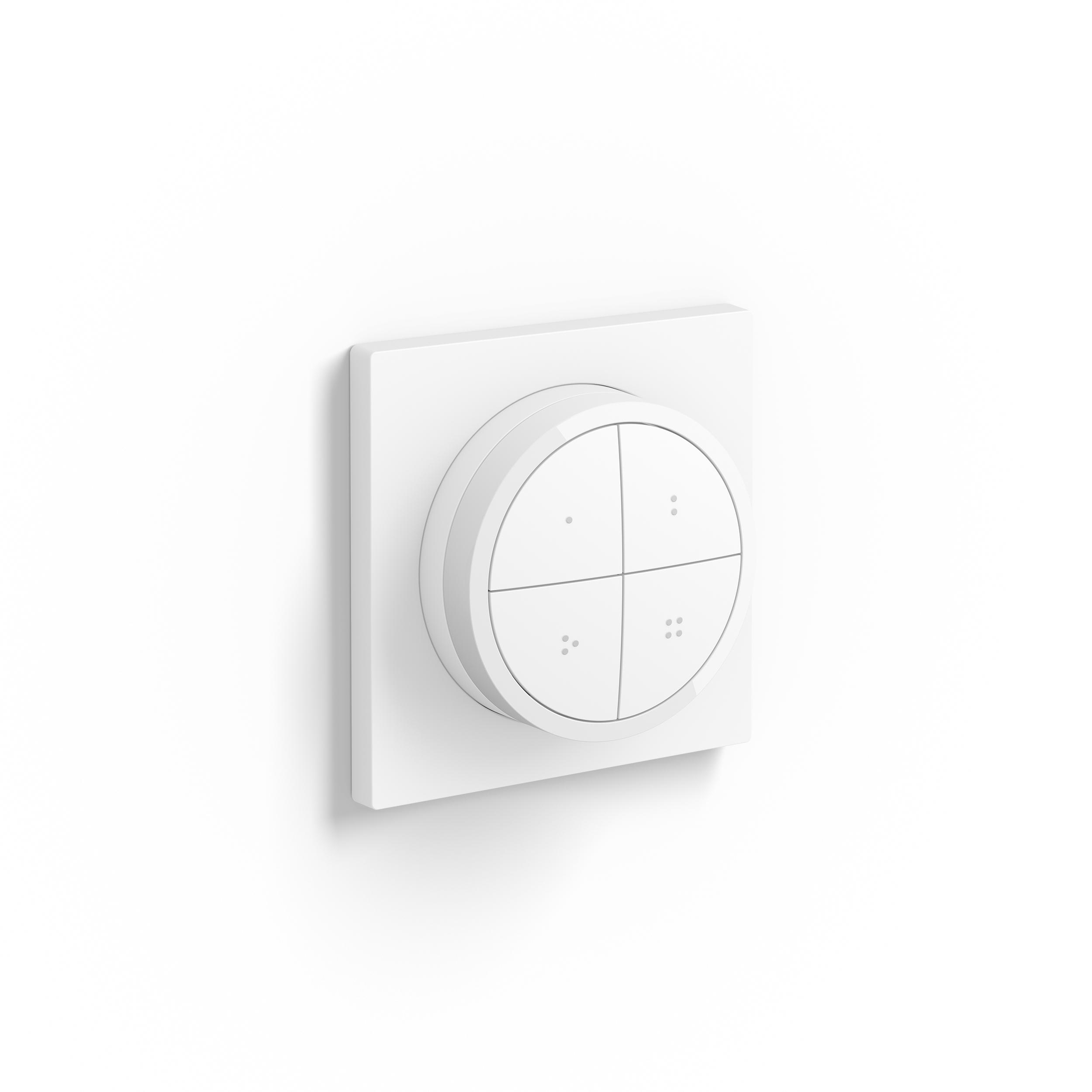 Ein weißes Smart-Home-Bedienfeld an einer weißen Wand, mit vier Knöpfen.