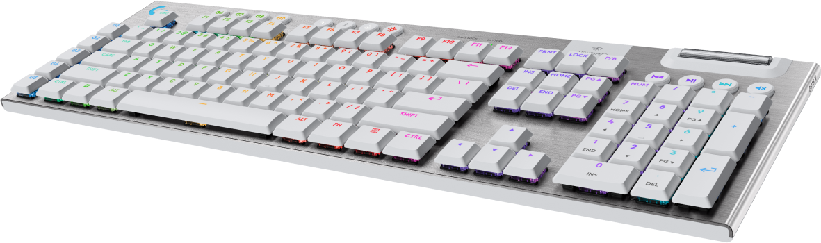 Clavier blanc rétroéclairé avec plusieurs touches. Le clavier est sur une surface noire.