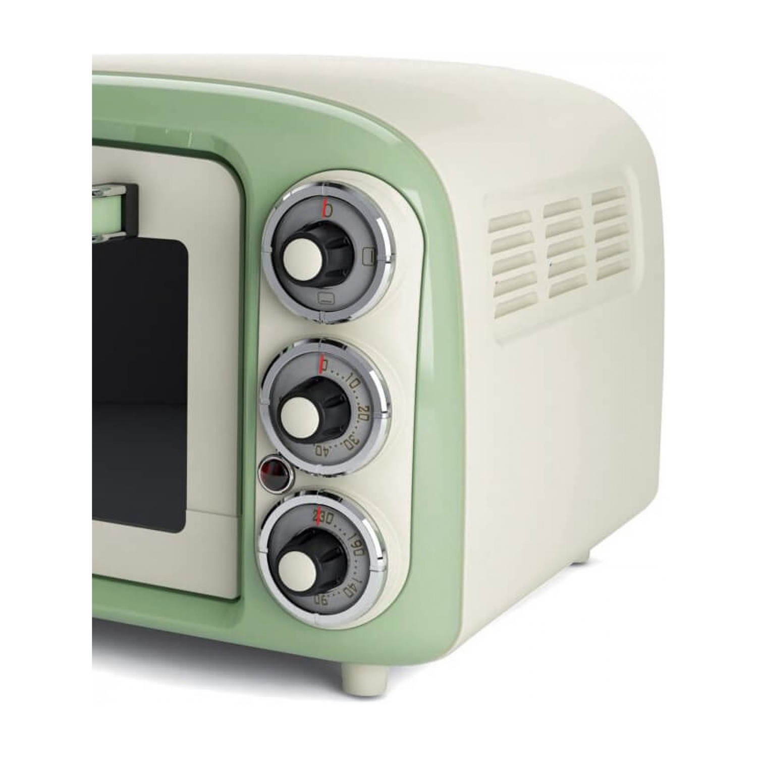 Un forno a microonde in stile retrò con colori verde e crema, e manopole di controllo.