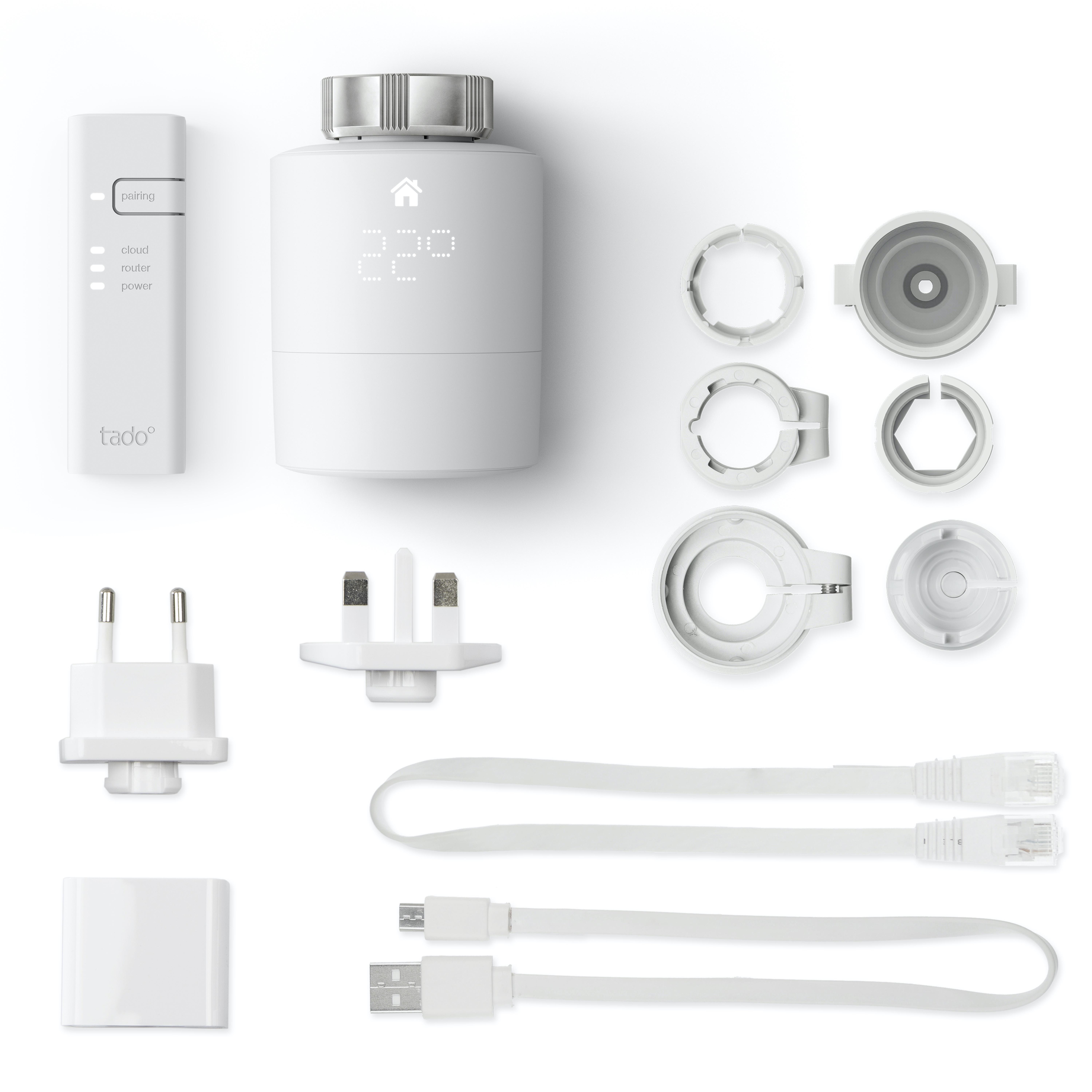 Weißes Smart-Home-Thermostat mit Zubehör: Stecker, Kabel und Montageteile.