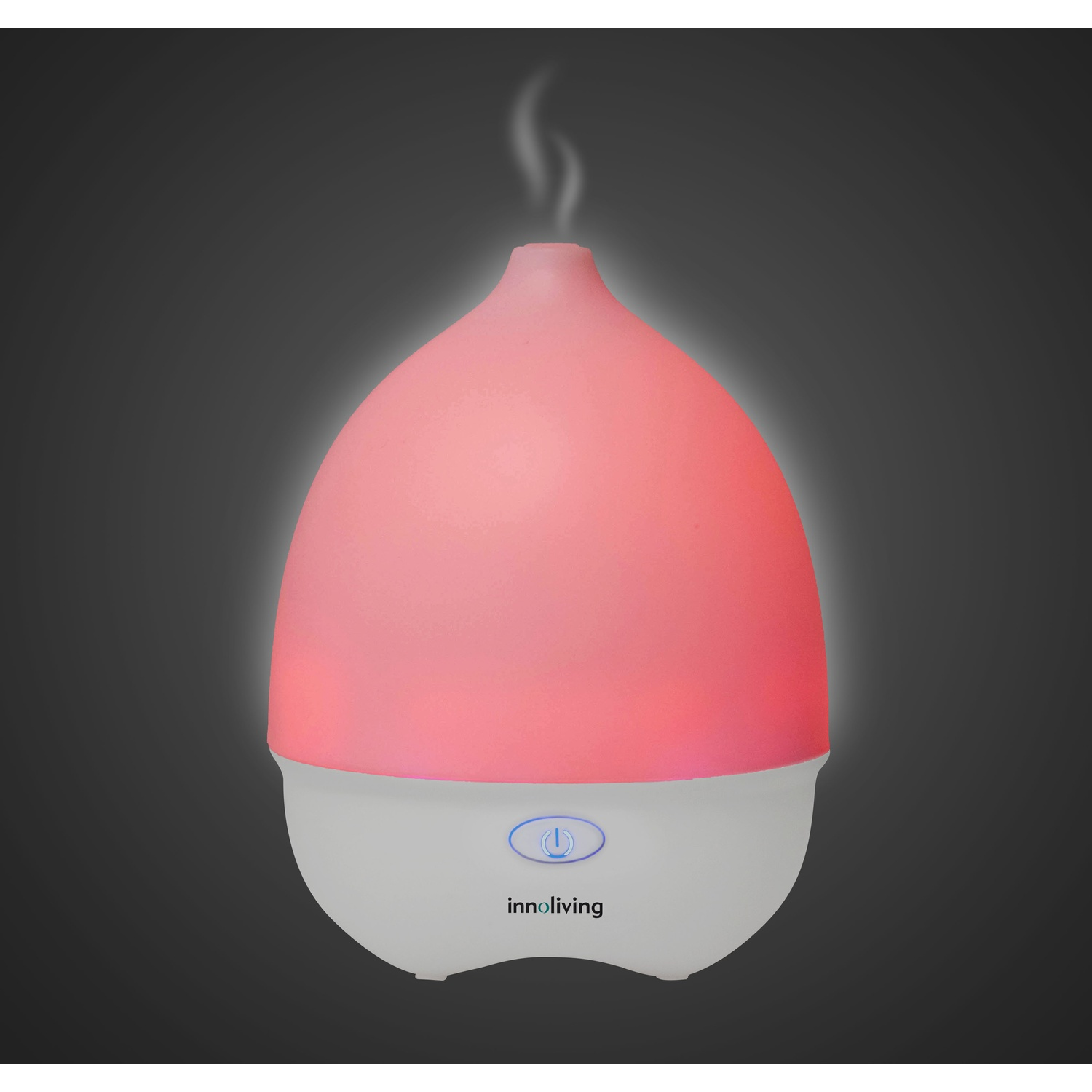 Diffusore di aromi bianco e rosa. Vapore che sale. Pulsante di accensione con luce blu.