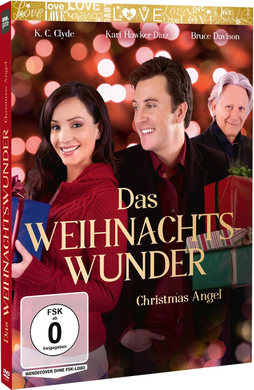 Film-DVD-Cover mit Paar, Text und Weihnachtsbaum im Hintergrund.