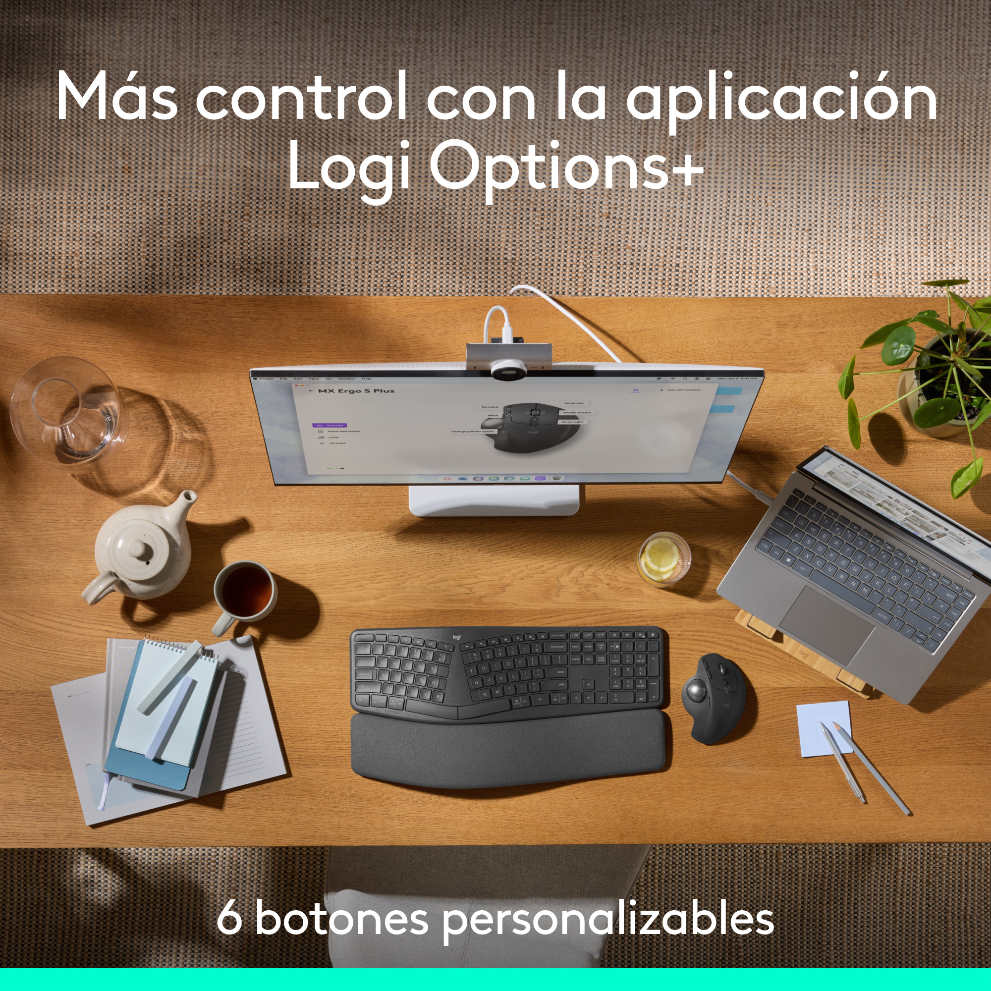 Una configuración de escritorio con un monitor, teclado, ratón y otros suministros de oficina en un escritorio de madera.