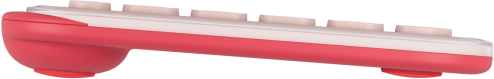 Egy rózsaszín-fehér billentyűzet oldalsó nézete. A billentyűk fehérek, az alap rózsaszín.