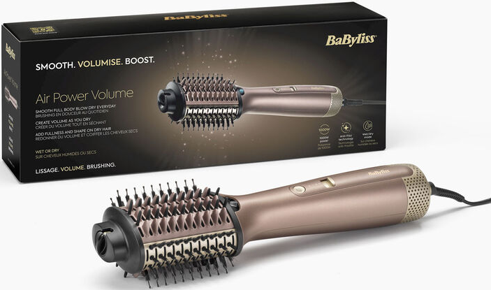 Spazzola per capelli e la sua scatola. La spazzola ha una finitura oro metallizzato.