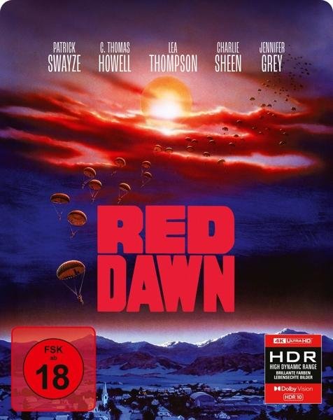 DVD-Cover für 'Red Dawn'. Zeigt Sonnenuntergang, Fallschirme und Schauspielernamen.