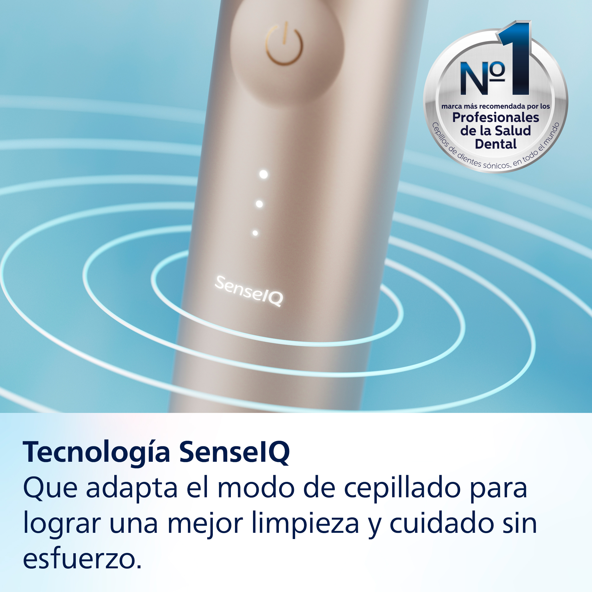 Primer plano de un cepillo de dientes eléctrico dorado. Tiene un botón de encendido y luces LED. Texto en español.