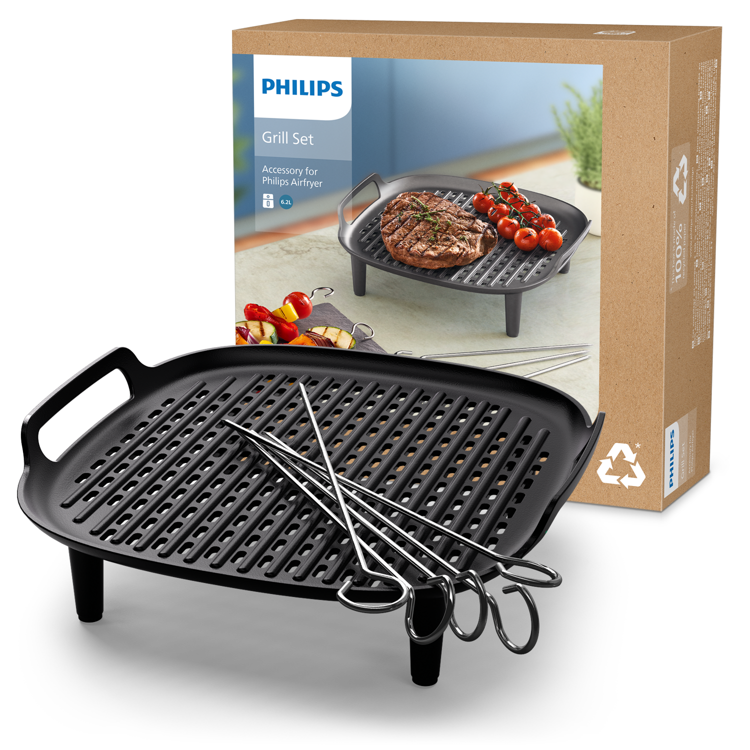 Egy grillszett egy grill serpenyővel, nyársakkal és egy dobozzal, benne étellel.