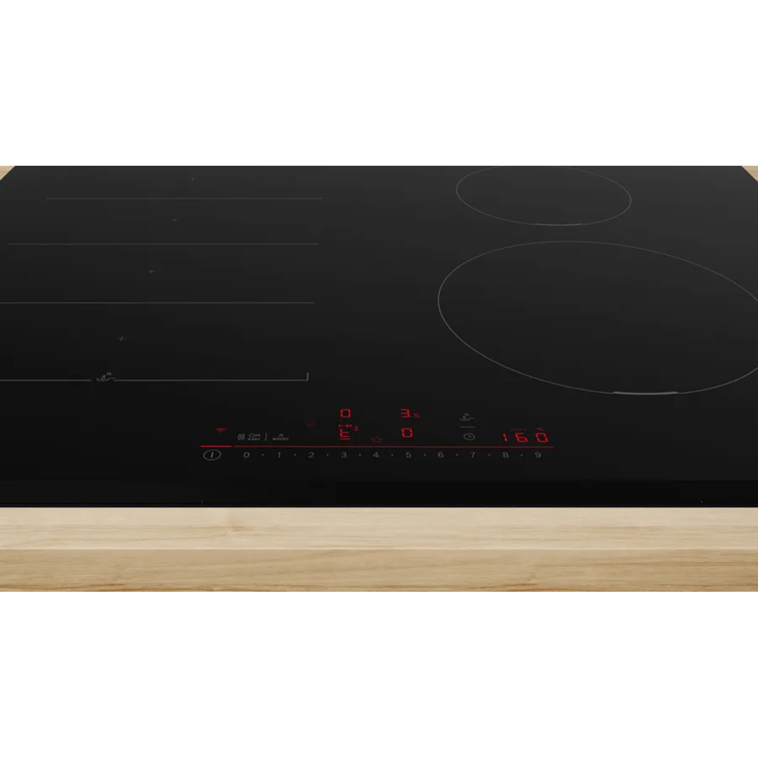Table de cuisson noire avec affichage numérique rouge et boutons de commande sur bois.