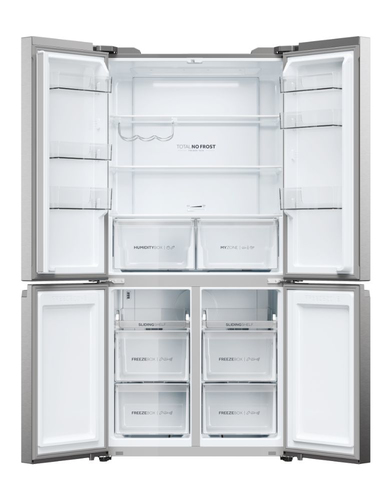 Refrigerador de acero inoxidable abierto con múltiples compartimentos y estantes vacíos.