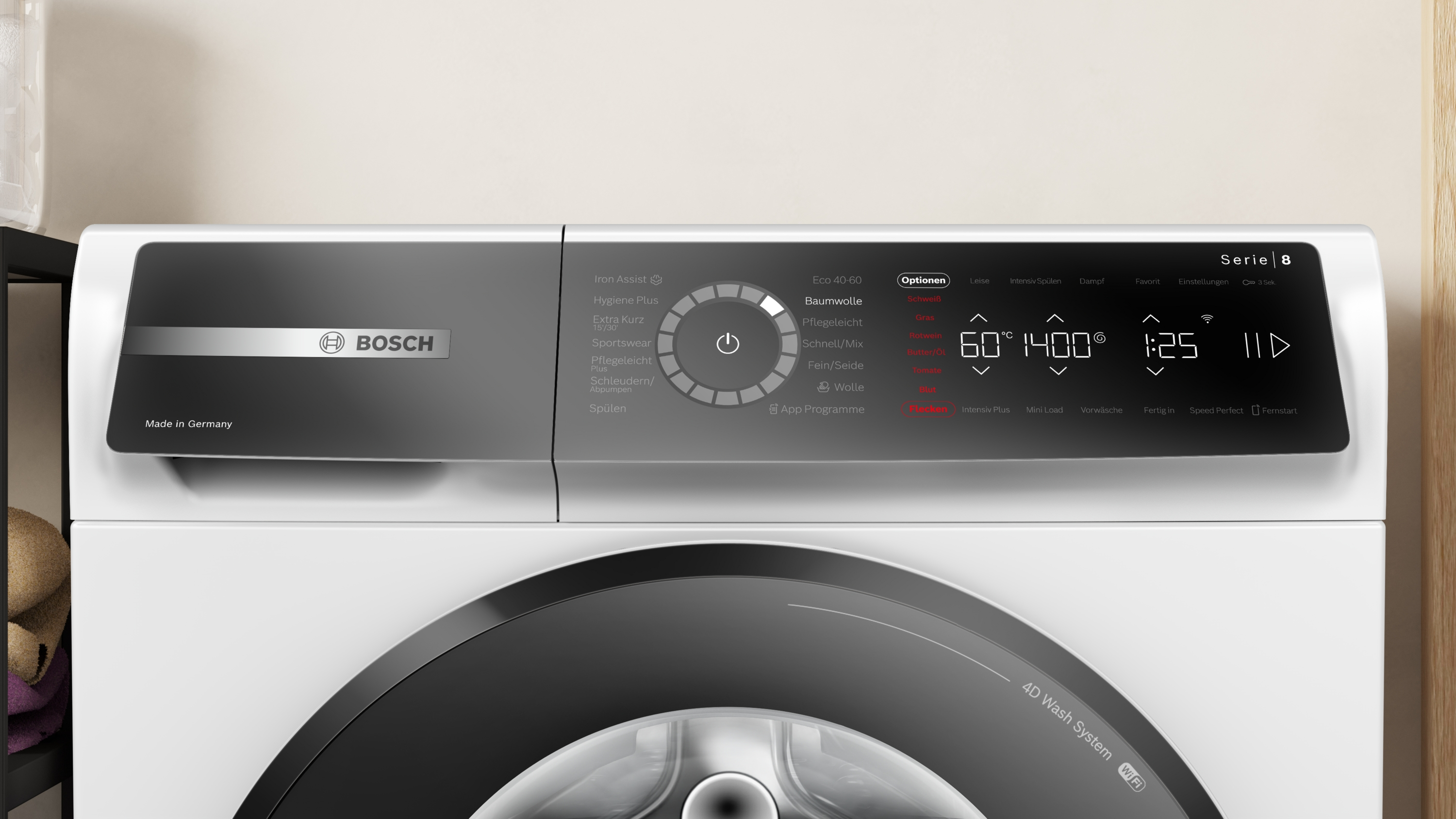 Ein weißer Beko Trockner. Der Trockner liegt auf der Seite und hat ein Bedienfeld und eine Tür.