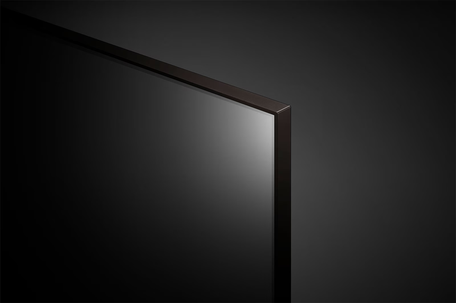 Narożnik ciemnego ekranu telewizora. Czarna ramka i tło.