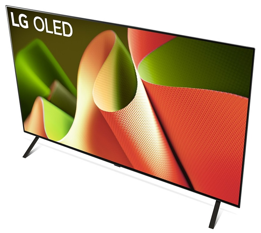 Telewizor LG OLED z widoku pod kątem. Pokazuje żywy ekran z kolorowym, abstrakcyjnym wzorem i czarną podstawą.
