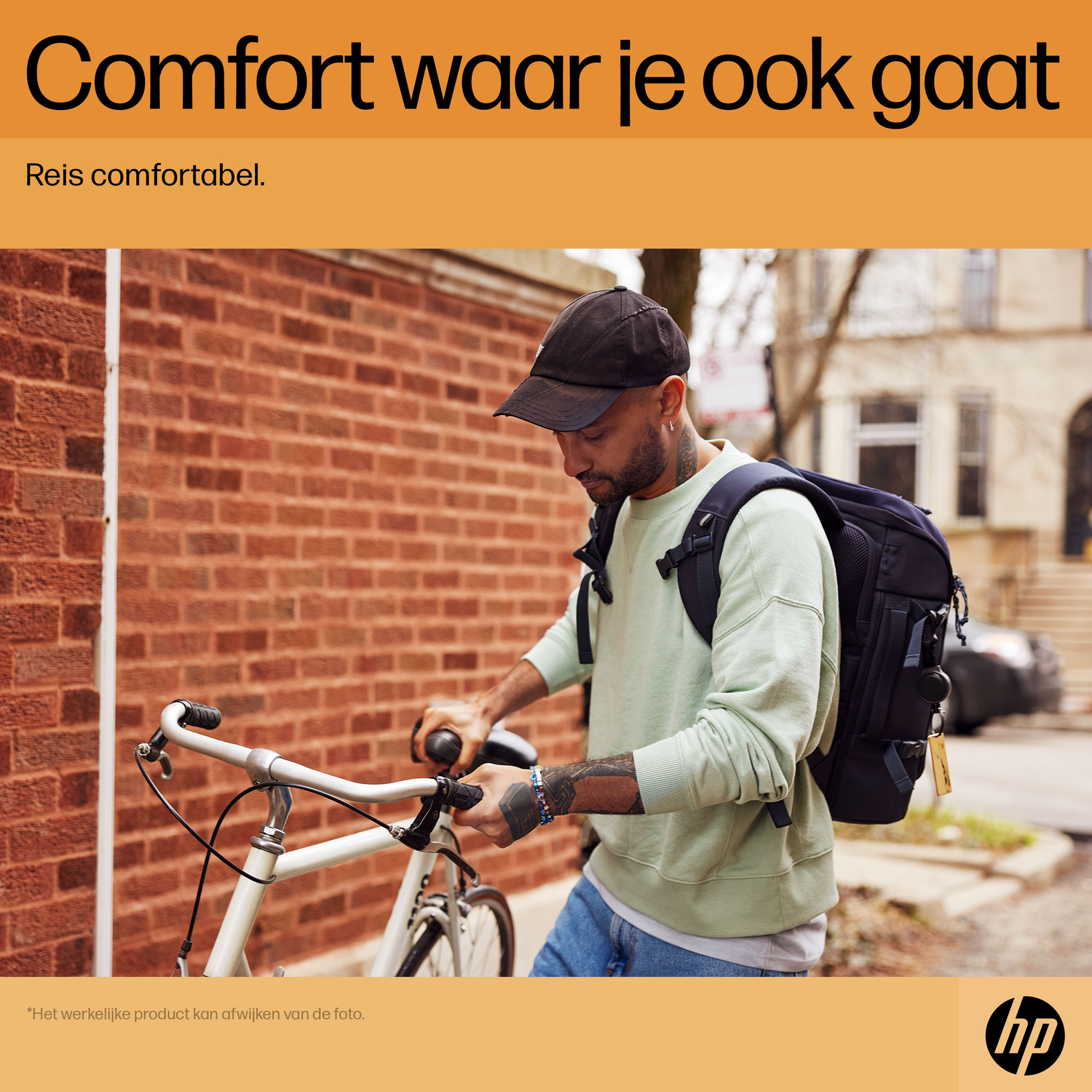 Man with backpack and bicycle standing near a brick wall. Text: Comfort wherever you go. Travel comfortable.