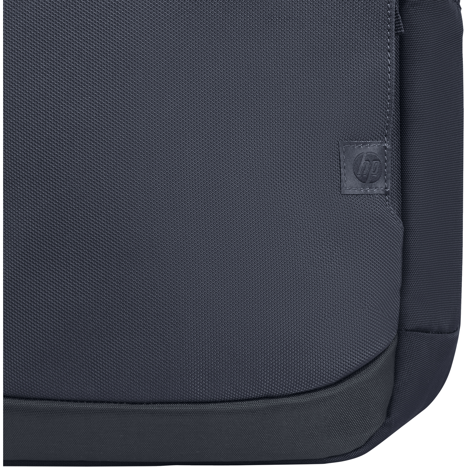Close-up of a dark blue HP messenger bag with the HP logo on a small square patch.