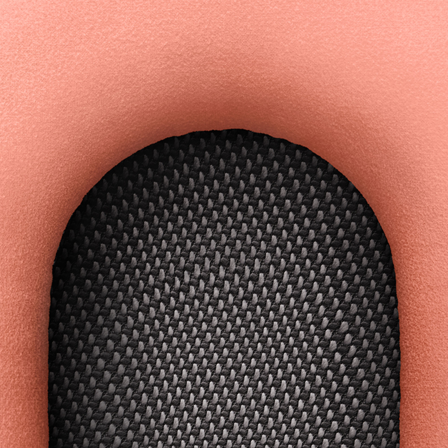 Primer plano de un material color melocotón que rodea una tela de malla gris oscuro.