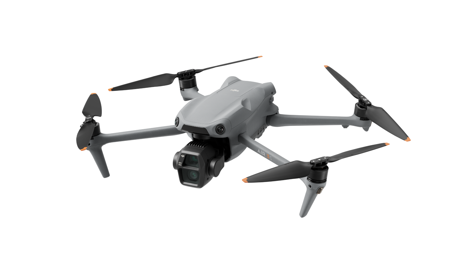 Dron gris con cuatro hélices. El dron está sobre un fondo negro.