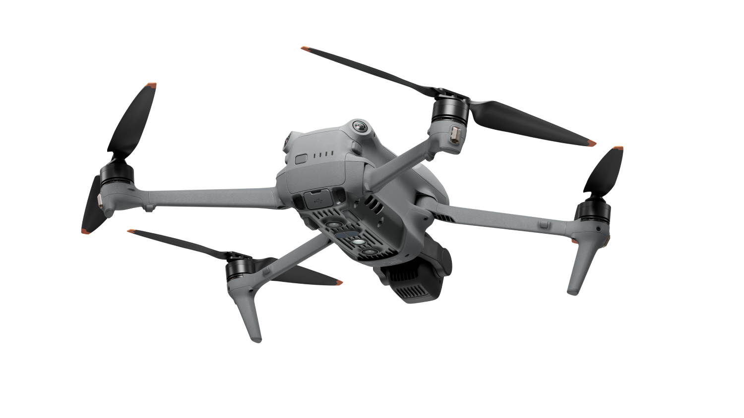 Dron gris con cuatro hélices sobre fondo negro. La cámara del dron es visible.
