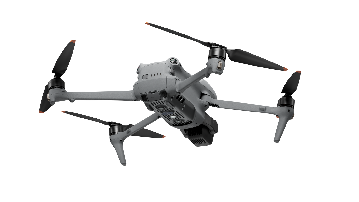 Dron gris con cuatro hélices, cámara y tren de aterrizaje. Está sobre un fondo negro.