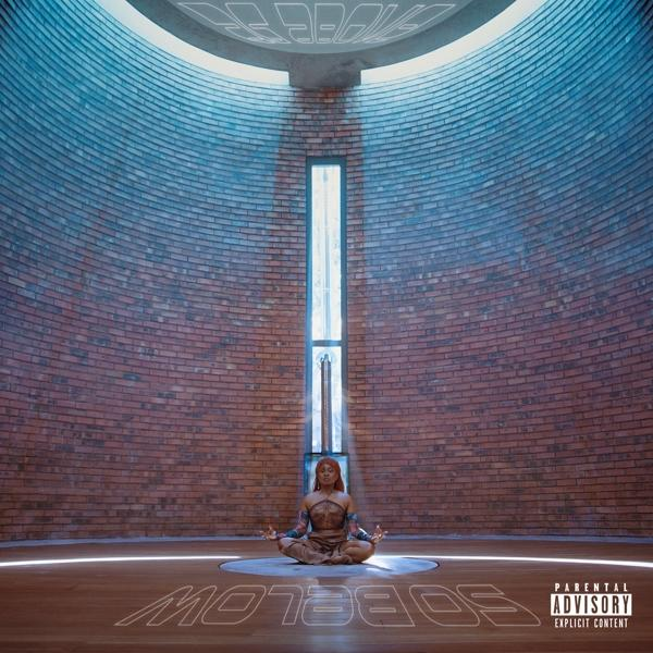 Albumcover. Eine Frau sitzt in meditativer Pose in einem Backsteindom mit hohem Fenster. Text: Below.