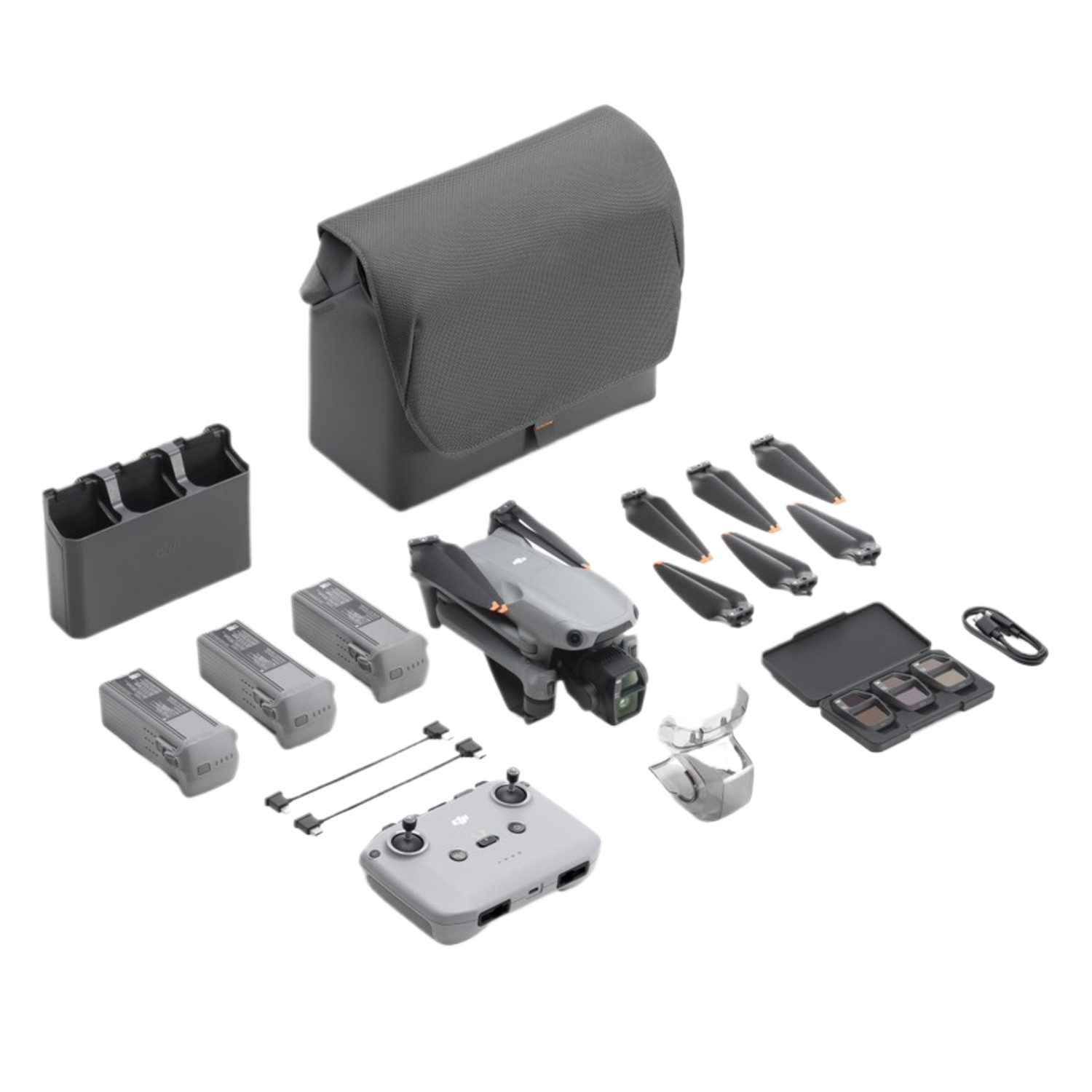 Drone kit: drone, oplader, batterijen, afstandsbediening, props en accessoires. Grijs en zwart.