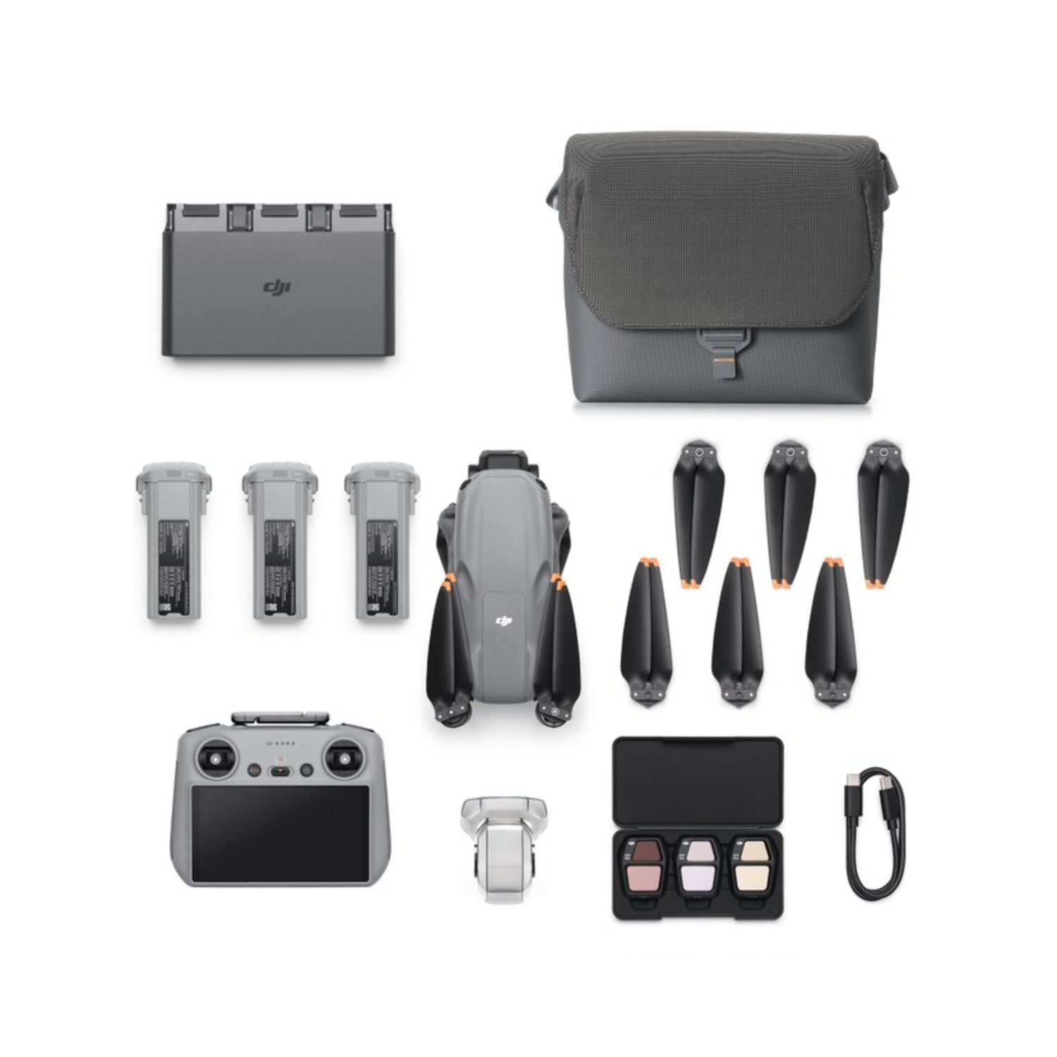 Drone kit with drone, batteries, remote, and accessories.