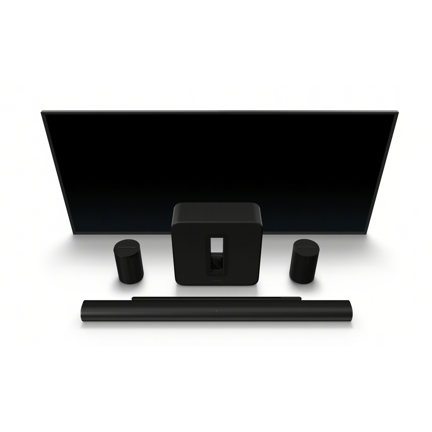 Black TV, soundbar, and two speakers on a white surface. The setup is clean.