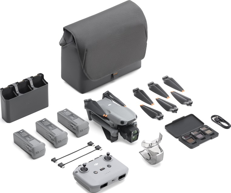 Un kit drone con drone, borsa, eliche, batterie, telecomando e accessori, tutto in grigio.