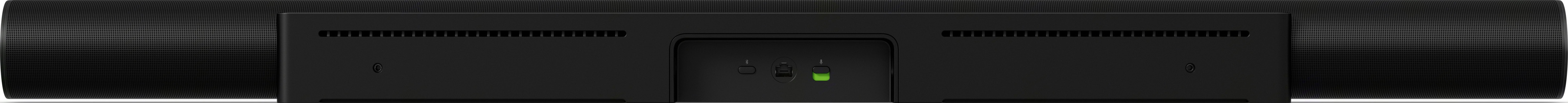 Appareil noir, forme rectangulaire. Trous de ventilation. Lumière verte au centre.