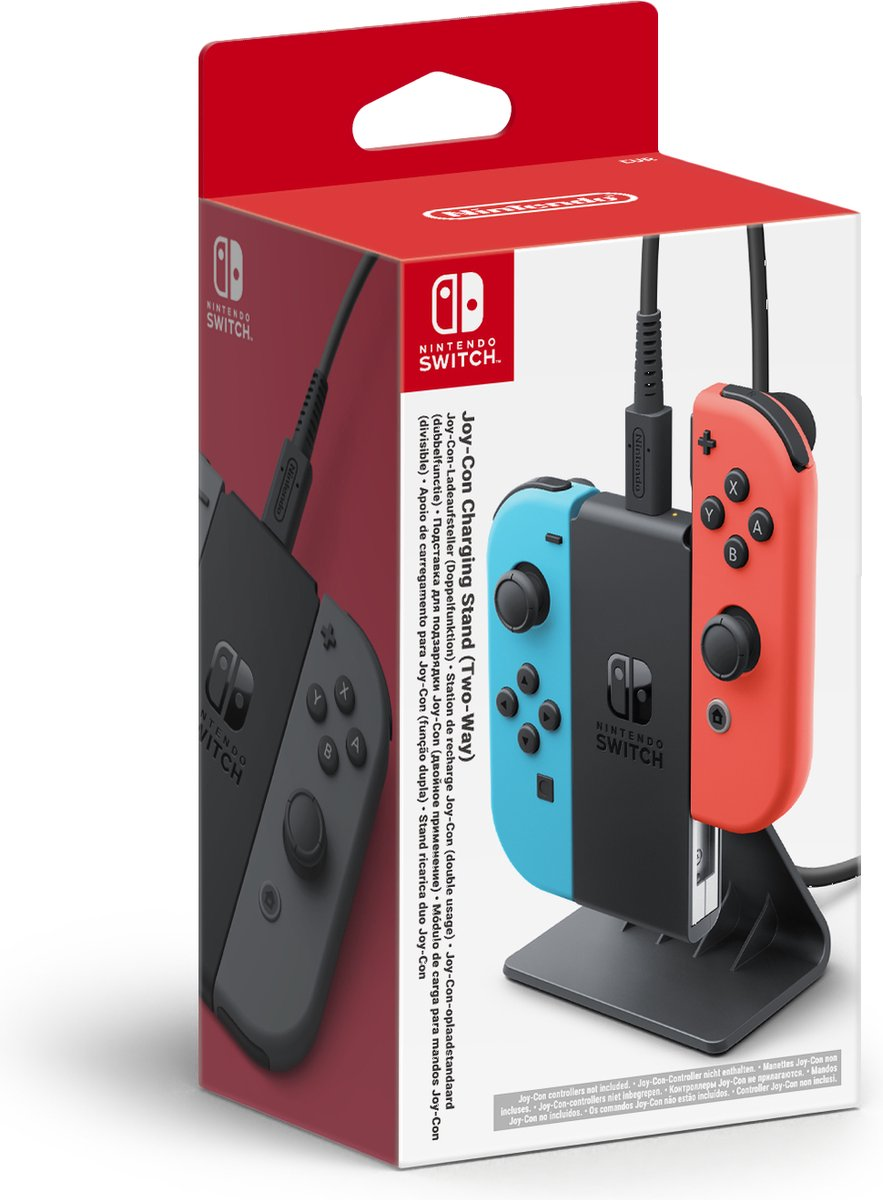 Support de charge Joy-Con Nintendo Switch dans une boîte, manettes bleues et rouges. Fond blanc.