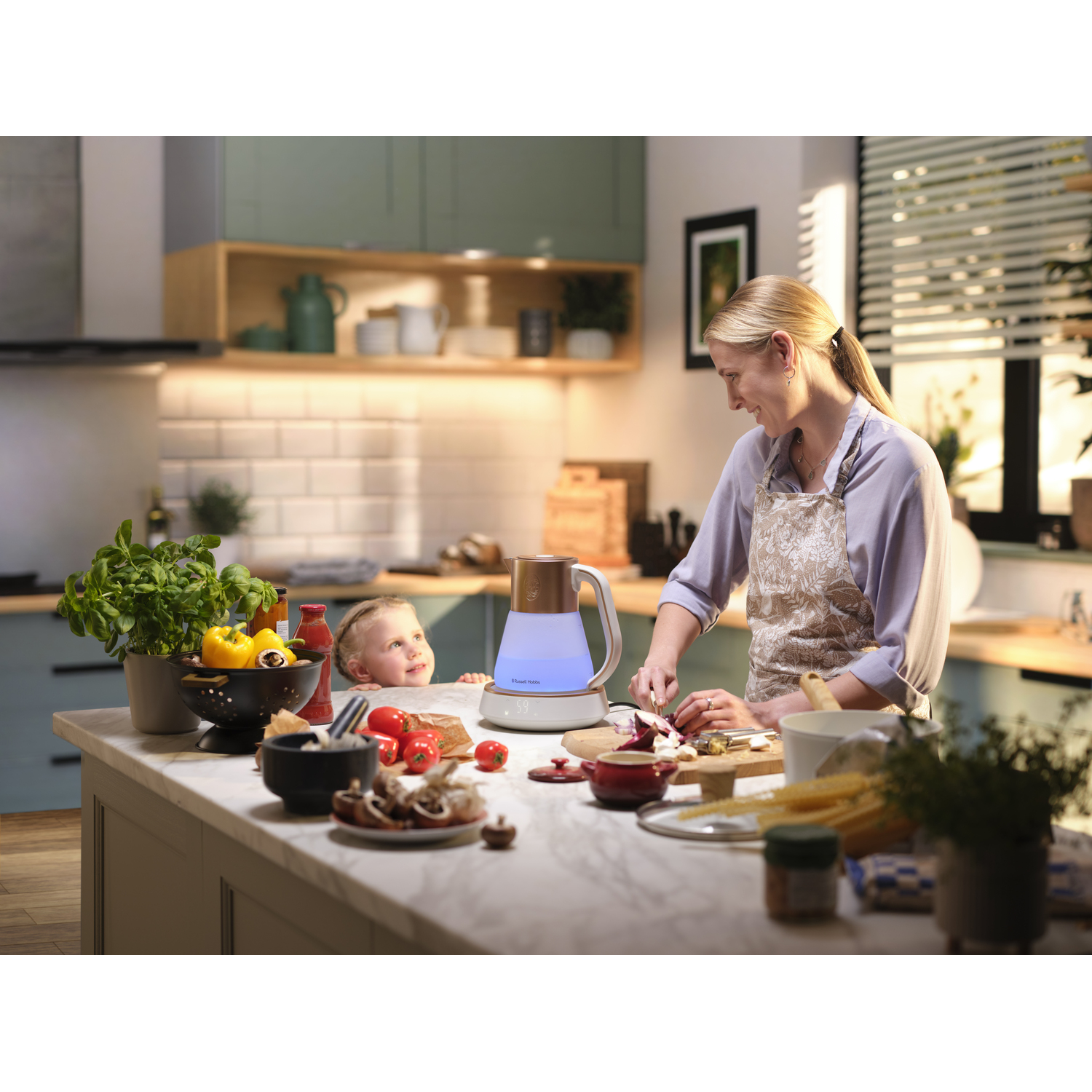 Woman and child in kitchen, woman cutting food near a kettle.